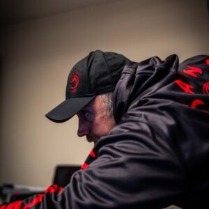 black kaine cues baseball cap with embroidered logo centered on the front.